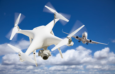 Image showing Unmanned Aircraft System (UAV) Quadcopter Drone In The Air Too C