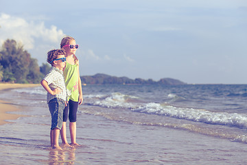 Image showing Happy children playing on the beach at the day time.