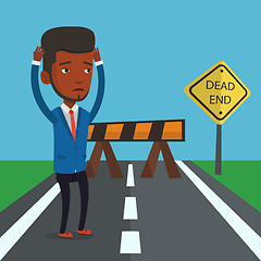 Image showing Businessman looking at road sign dead end.