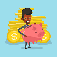 Image showing Businessman holding a big piggy bank.