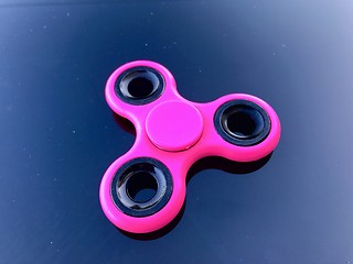 Image showing purple fidget spinner stress relieving toy