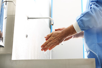 Image showing Surgeon washing hands.