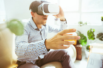 Image showing The man with glasses of virtual reality. Future technology concept.