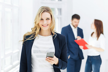 Image showing Portrait of businesswoman talking on phone in office