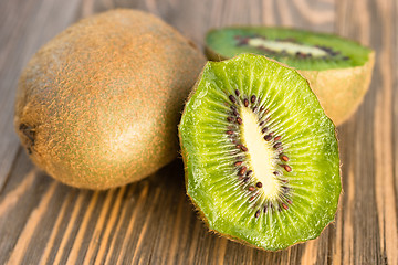 Image showing Whole Food Fruit Green Kiwi Halves Seeds Cutting Board