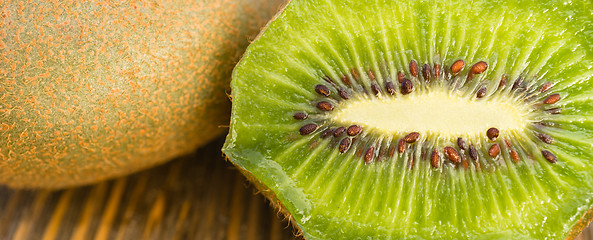Image showing Whole Food Fruit Green Kiwi Halves Seeds Cutting Board
