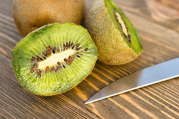 Image showing Whole Food Fruit Green Kiwi Halves Knife Cutting Board