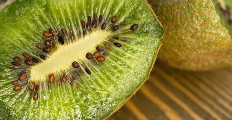 Image showing Whole Food Fruit Green Kiwi Halves Seeds Cutting Board