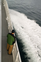 Image showing Speeding Ferry Boat Wake of Ocean Spray Man Looking