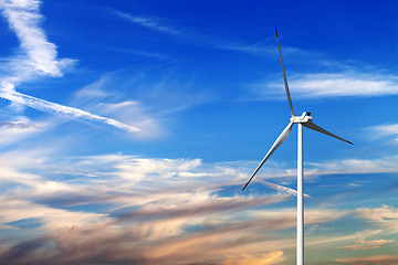 Image showing Wind turbine and multicolor sunrise sky