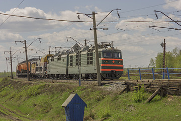 Image showing Green freight train transports cargo by rail