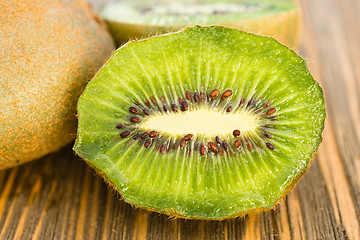 Image showing Whole Food Fruit Green Kiwi Halves Seeds Cutting Board