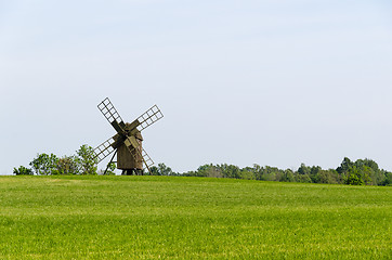Image showing Old wooden windmill in a field