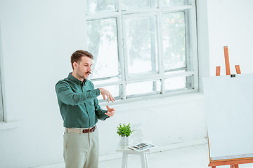 Image showing Speaker at Business Meeting in the conference hall.