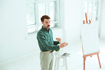 Image showing Speaker at Business Meeting in the conference hall.