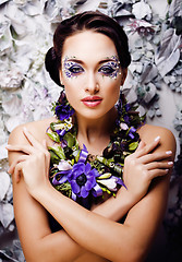 Image showing floral face art with anemone in jewelry, sensual young brunette 