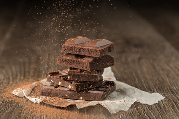 Image showing Chocolate with nuts sprinkled cocoa