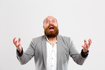 Image showing Brutal screaming man looking up