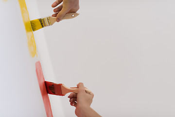 Image showing couple painting interior wall