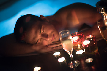 Image showing man relaxing in the jacuzzi