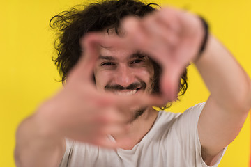 Image showing young man with funny hair over color background