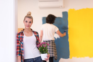 Image showing happy young couple doing home renovations