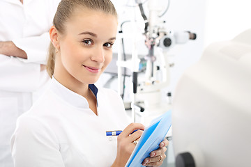 Image showing Ophthalmology, eye doctors office.  Young attractive doctor ophthalmologist at an ophthalmologist 