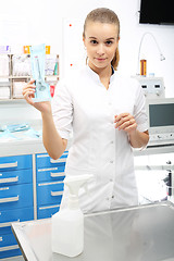 Image showing The nurse unpacks sterile syringe, Medical supplies