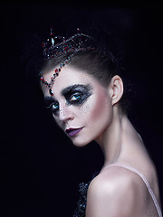 Image showing Portrait of the ballerina in the role of a black swan on black background