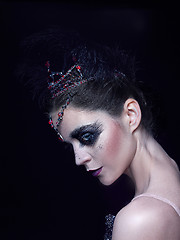 Image showing Portrait of the ballerina in the role of a black swan on black background