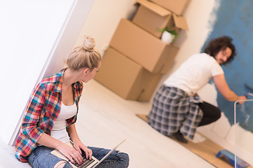 Image showing Happy couple doing home renovations