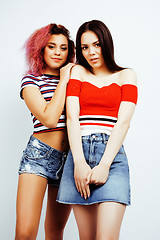 Image showing lifestyle people concept: two pretty stylish modern hipster teen girl having fun together, diverse nation mixed races, happy smiling making selfie closeup