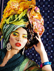 Image showing beauty bright woman with creative make up, many shawls on head l