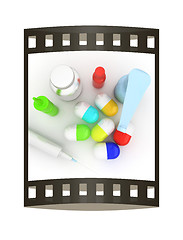 Image showing Syringe, tablet, pill jar. 3D illustration. The film strip