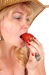 Image showing Closeup of woman eating strawberry.