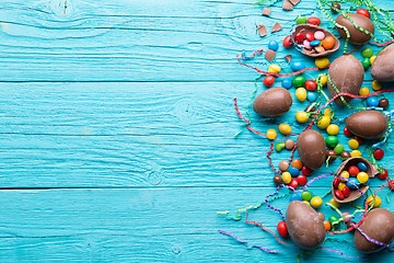 Image showing Chocolate on blue wooden table