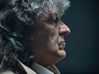 Image showing The senior man as detective or boss of mafia on gray studio background