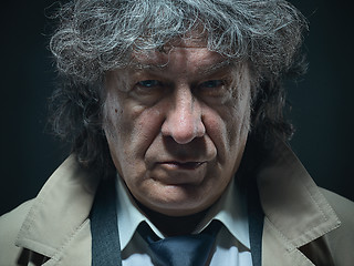 Image showing The senior man as detective or boss of mafia on gray studio background