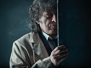 Image showing The senior man as detective or boss of mafia on gray studio background