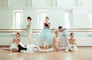 Image showing The seven ballerinas at ballet bar