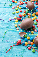 Image showing Photo of eggs, chocolates, ribbons
