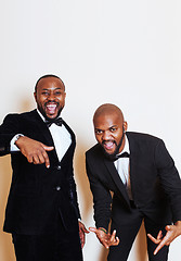 Image showing two afro-american businessmen in black suits emotional posing, g