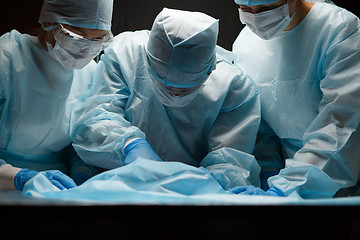 Image showing Photo of doctors , black background