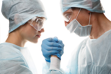 Image showing Young medical workers make handshake