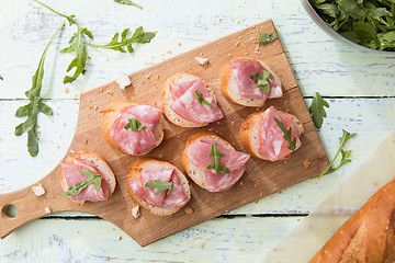 Image showing Ham sandwich on wooden board
