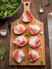 Image showing Appetizing sandwiches on wooden board