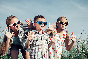 Image showing Happy children playing on the field at the day time.