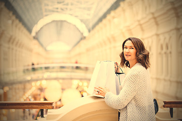 Image showing woman with packages in a shopping center