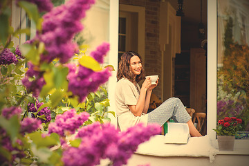 Image showing beautiful woman with a cup of hot drink