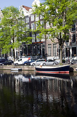 Image showing canal with boats and homes amsterdam holland